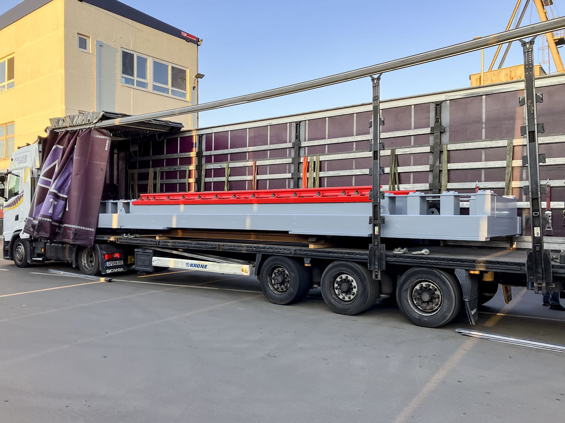 Truck unloads construction tools at construction site