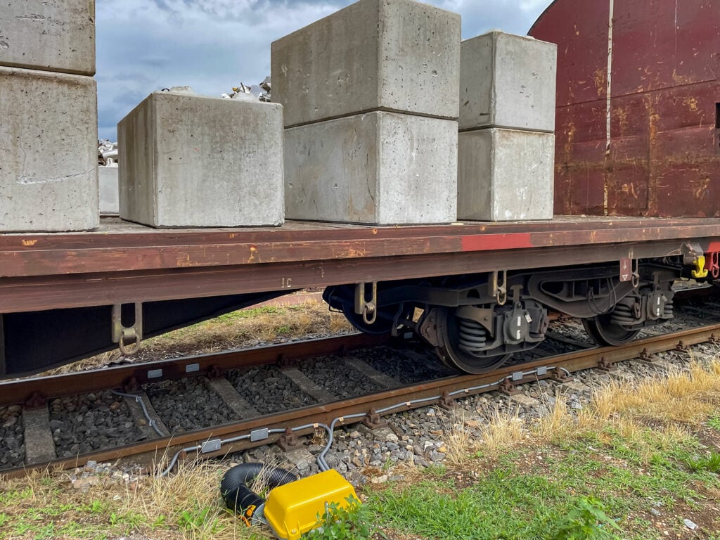 Freight wagon with concrete blocks on rails