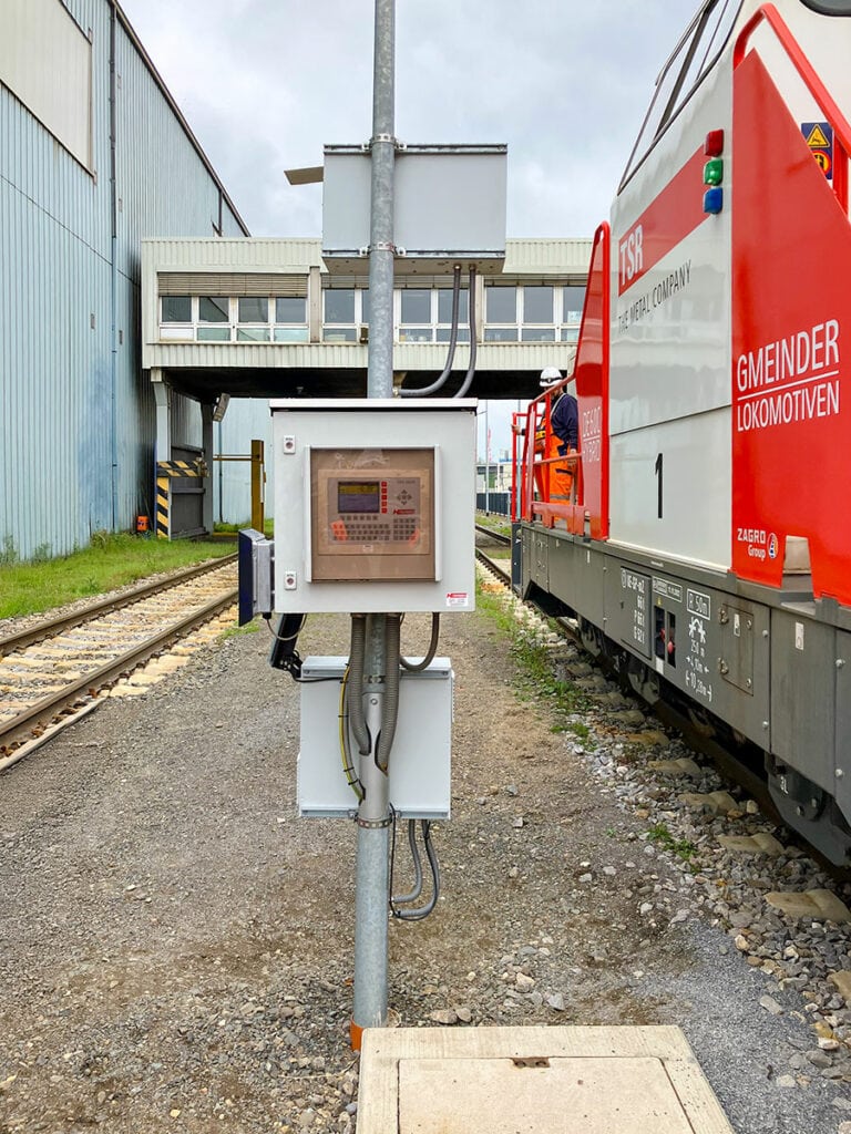Locomotive next to tracks and switchgear